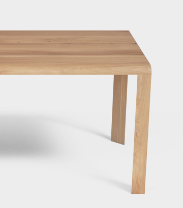 Triangular legs integrated directly into the tabletop.